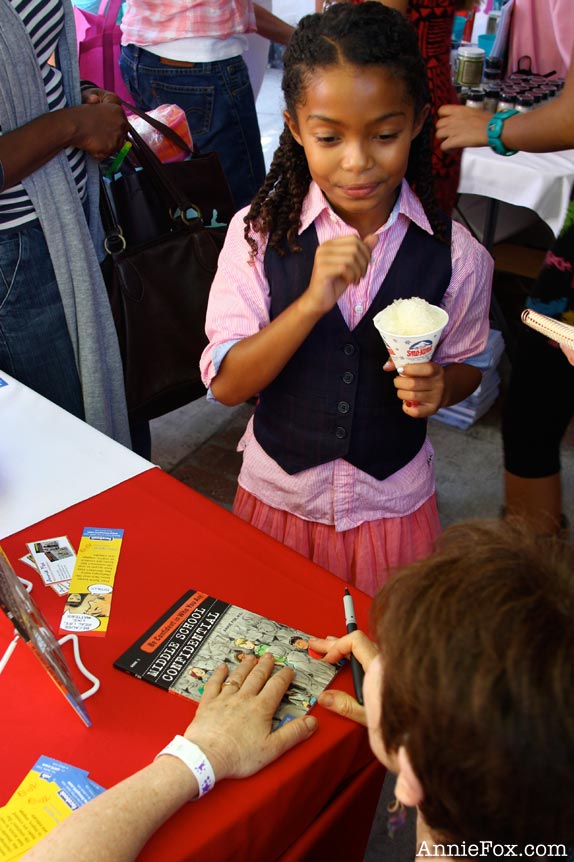 Annie Fox autographs ''Real Friends vs. the Other Kind'' for Yara Shahidi